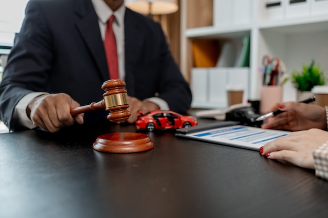 AG Injury Law Atlanta car accident lawyer consulting with client about concussion brain injury claim and compensation