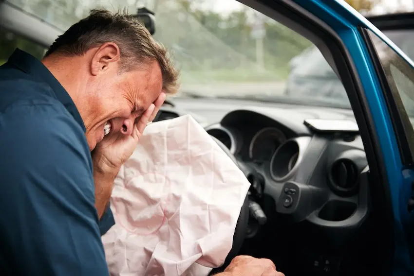 Car accident victim in shock at Georgia crash scene with adrenaline masking serious injury symptoms immediately after collision